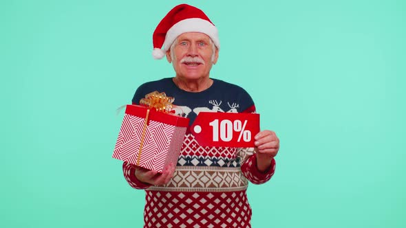 Grandfather in Christmas Sweater Showing Gift Box and 10 Percent Discount Inscriptions Banner Text