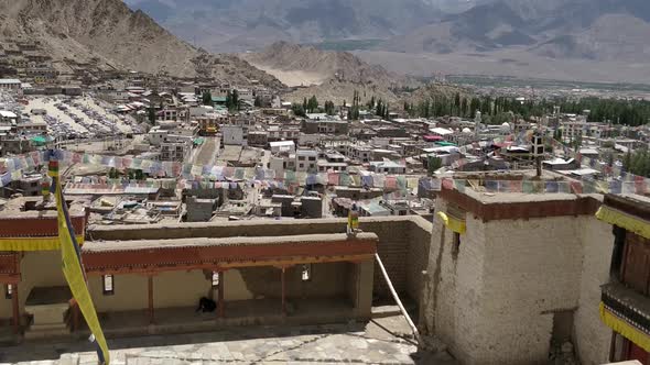 the leh city with house made of mud and local materials crowded the Buddhist flag fluttering due to