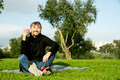 Middle aged man drinking coffee in the park - PhotoDune Item for Sale