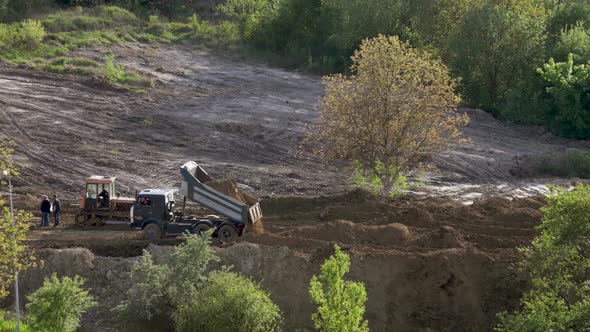 Timelapse: bulldozer flattening surface on further construction site