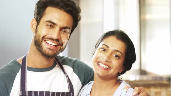 Happy couple standing together in kitchen 4k