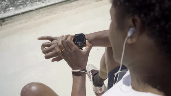Focused African American Man Setting Sport Watch