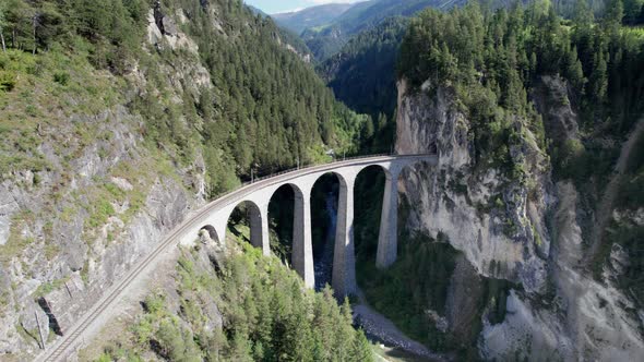 Landwasser Viaduct in Swiss Alps in Summer Aerial View on Green Mountain Valley