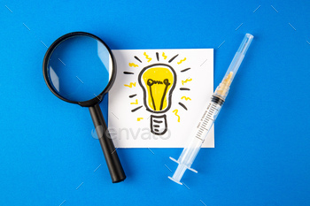 ghtbulb drawing on blue background hospital health virus covid- pandemic lab drug science
