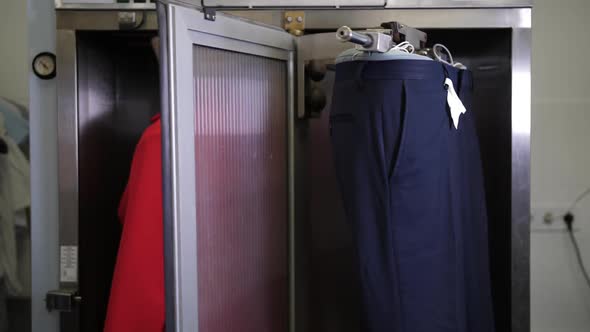 Women's Jacket and Men's Pants During Steaming