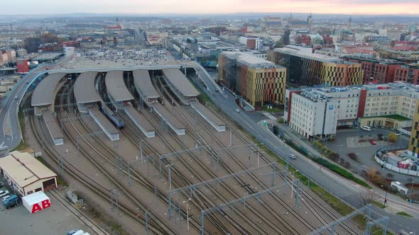 Drone shot of a train leaving Krakow railway station, Poland