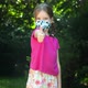 Young school age girl, child putting on a protective face mask and showing a thumbs up gesture - VideoHive Item for Sale