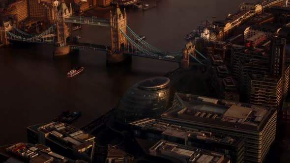 Aerial view of the London City Hall, Tower Bridge and the Thames during the golden hour