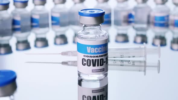 Glass vials for Covid-19 vaccine in laboratory. Group of Coronavirus vaccine bottles.