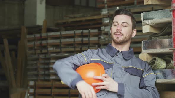 Heavy Industry Manufacturer Relaxing After Work Smiling Looking Away