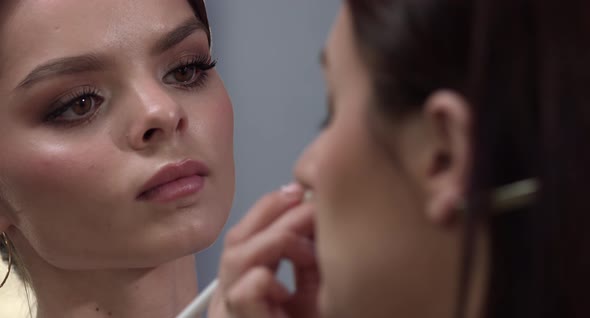 Lovely Girl Doing Makeup