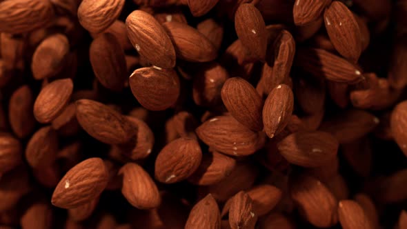 Super Slow Motion Shot of Almonds Flies After Being Exploded at 1000Fps.