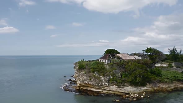 Drone flies around the island with Fort James ruins, liner in St. John's, Antigua and Barbuda