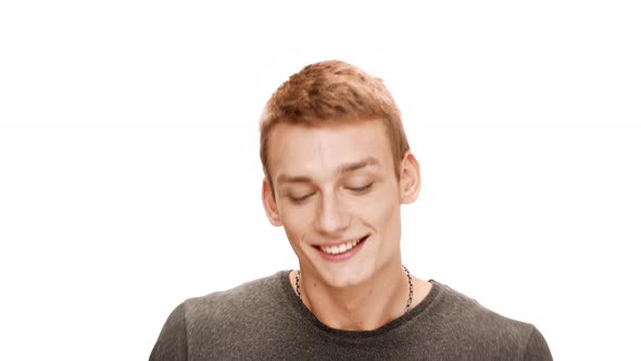 Young Handsome Man Smiling Speaking Over White Background