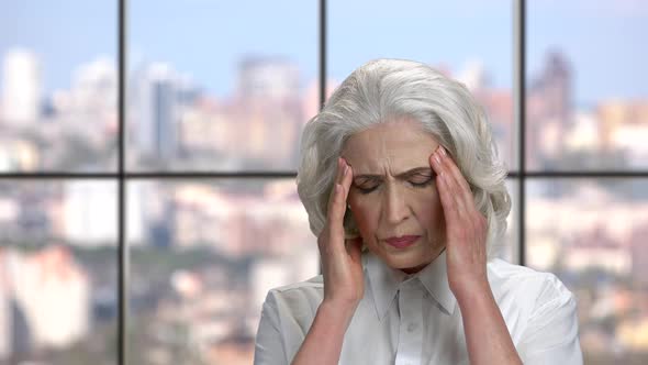 Unhappy Mature Woman Suffering From Headache