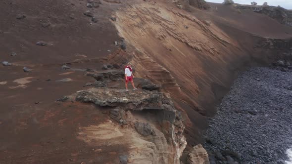 Male Hiker Enjoying Ocean Landscape at Capelinhos Volcano Faial Island Azores