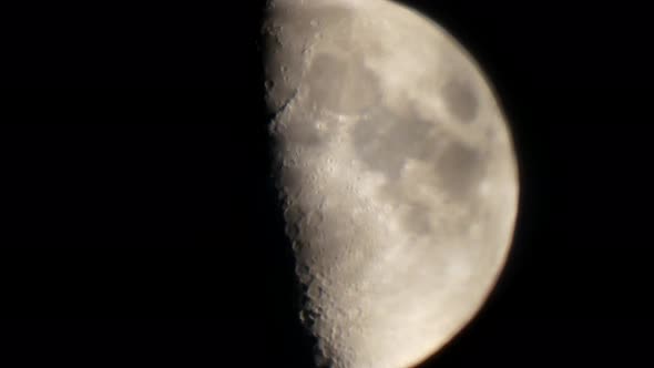 Close up of the moon rising in the night sky