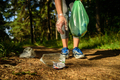 Woman collecting garbage in forest - PhotoDune Item for Sale