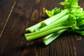 Celery stalks on wooden background - PhotoDune Item for Sale