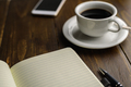 Black coffee and notebook on desk - PhotoDune Item for Sale