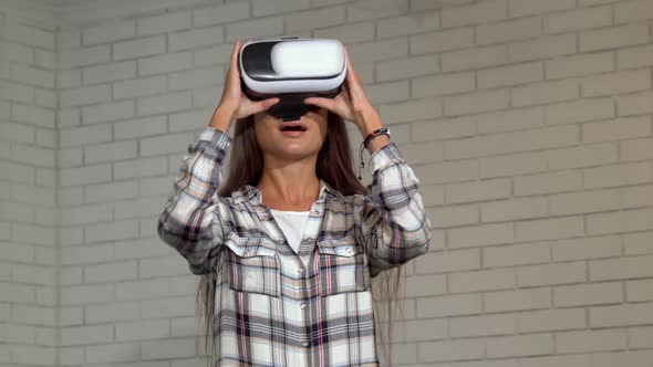 Attractive Young Woman Looking Excited, Using Virtual Reality Glasses