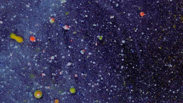 Rounded Red Yellow Particles on a Bluewhite Background with Sequins