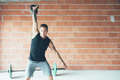 Sporty_young_man_doing_kettlebell_swing_exercise - PhotoDune Item for Sale