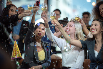 Young business people have fun at a New Year's party 2020 / Photodune, Misc