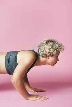 rkout in a pink background studio