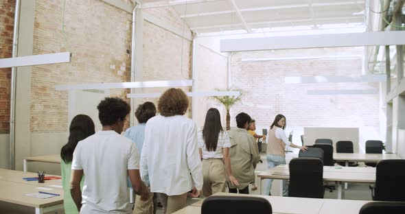 Group of Diverse Office Workers Walk Into Office or Coworking and Sit Down