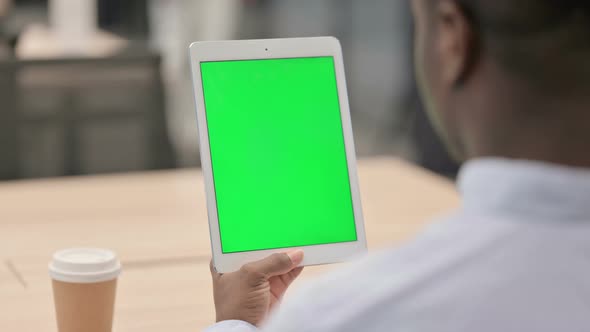 African Businessman Using Tablet with Chroma Screen