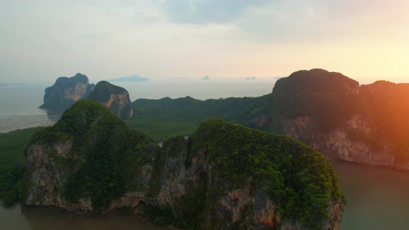 Aerial view over the coast, mountains and beaches during beautiful sunsets