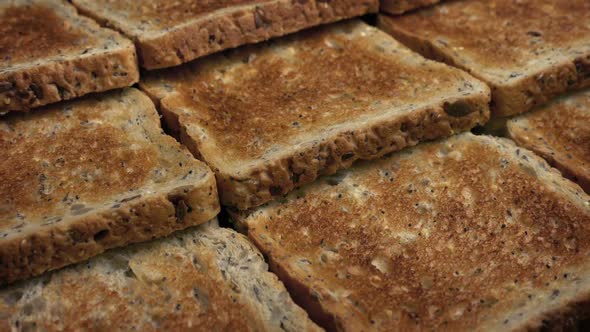 Passing Pieces Of Toast With Grains