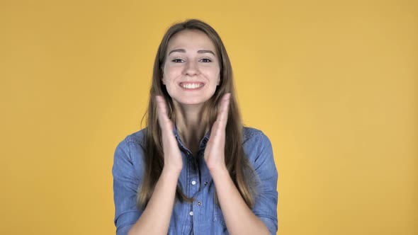 Applauding African Girl, Clapping Isolated on Yellow Background