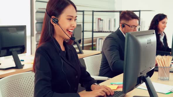 Business People Wearing Headset Working in Office