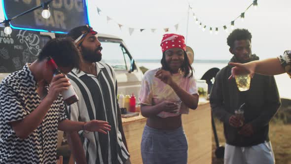 Young Multiethnic Friends Dancing at Summer Festival