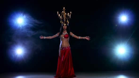 Attractive Belly Dancer Woman Dancing with Candles on Her Head, Black, Smoke