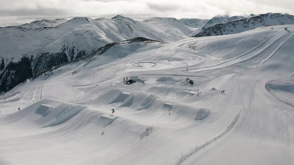 Livigno Italy  February 21 2022 People Snowboarding and Skiing at Ski Resort