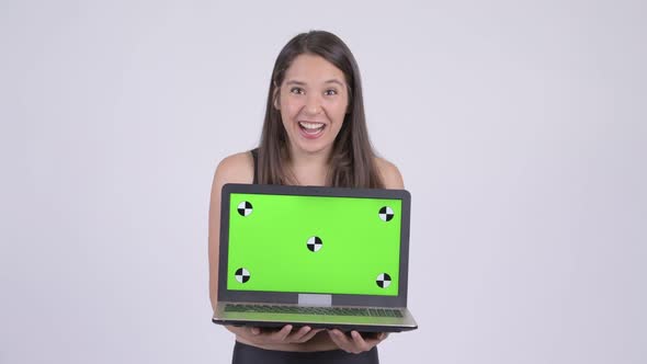 Young Happy Multi-ethnic Woman Showing Laptop and Looking Surprised Ready for Gym