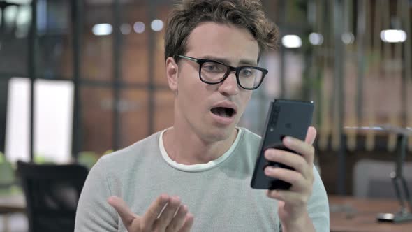 Portrait Shoot of Shocked Guy Get Upset on Smartphone