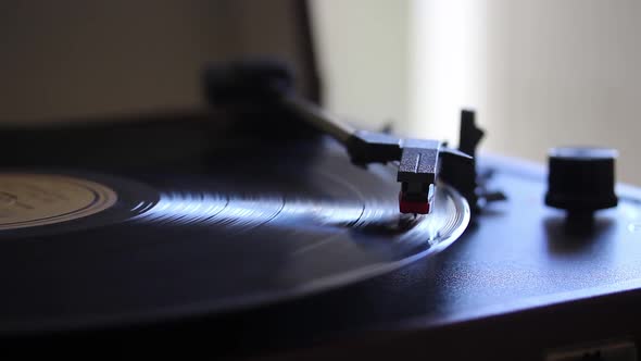 Playing a Vinyl Record on a Record Player.