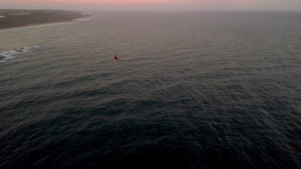 Helicopter early at dawn across the beach