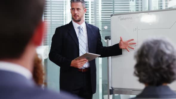 Businessman giving a presentation in a meeting