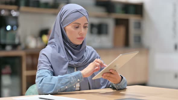 Young Arab Woman Using Digital Tablet at Work