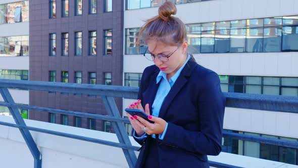 Sad Business Woman Reads Latest News at Phone