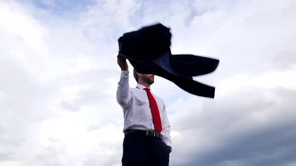 Mature Business Leader with Jacket on Sky Background Leadership