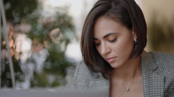 Portrait of Ambitious Muslim Business Woman Working with Laptop Indoors at Home Concentrated on