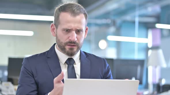 Portrait of Shocked Businessman Getting Upset in Office