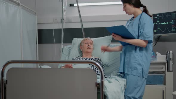 Medical Worker Taking Notes About Treatment Progress