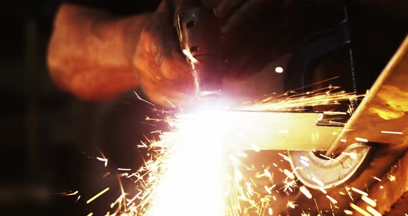 Mid-section of welder using welding torch